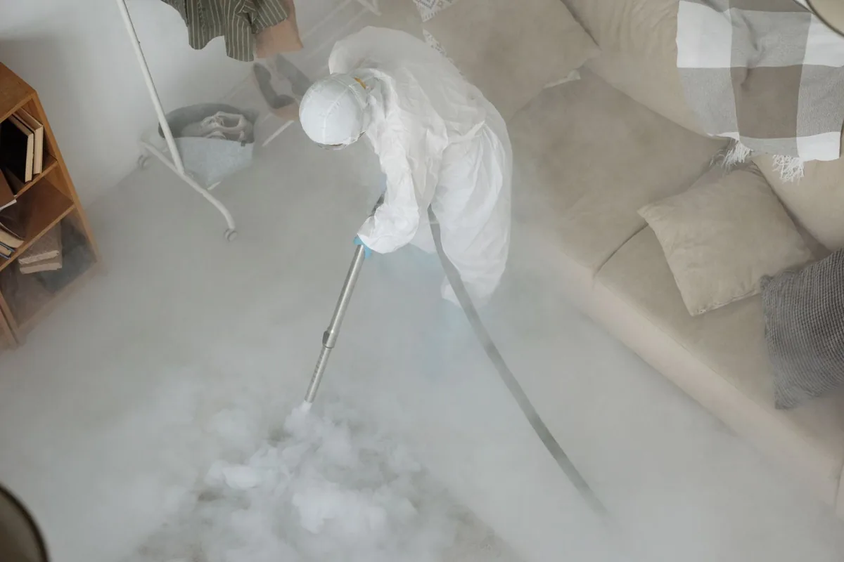 Biohazard cleanup technician in protective equipment, Budd Lake, NJ